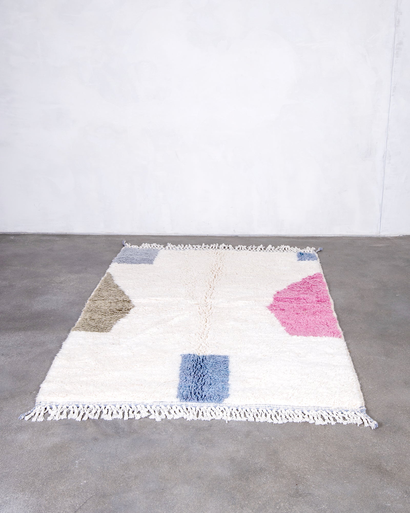 Modern, designer, handcrafted Berber rug from Morocco. Beniourain carpet with beautiful colors and patterns and fluffy wool texture.